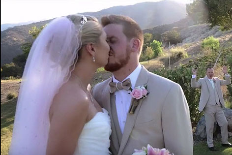 Alicia and Matthew Bates embrace at their wedding.